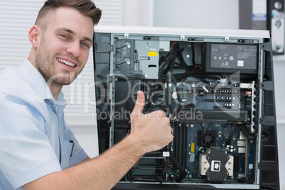 Hardware professional gesturing thumbs up by open cpu