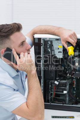 Young computer engineer working on cpu while on call