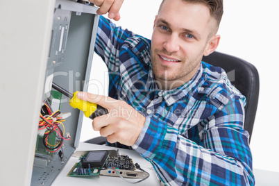 Computer engineer repairing cpu at workplace