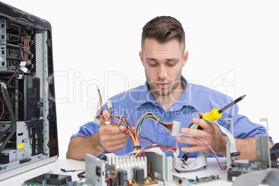 Young computer engineer working on cpu parts