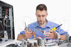 Young computer engineer working on cpu parts