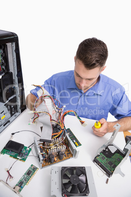 Young computer engineer working on cpu parts