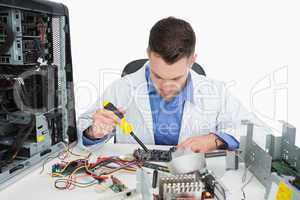 Young computer engineer working on cpu parts
