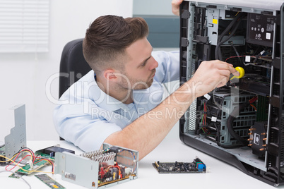 Hardware professional examining cpu with stethoscope