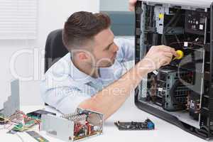 Hardware professional examining cpu with stethoscope