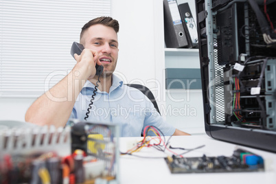 Hardware professional sitting by an open cpu while on call