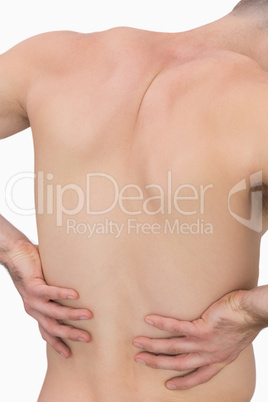 Rear view of muscular man with backache