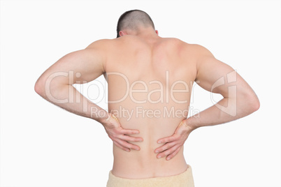 Rear view of shirtless man with back pain