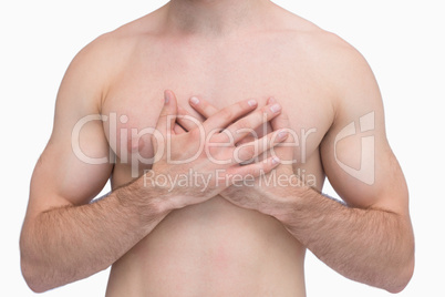 Midsection of shirtless man with chest pain