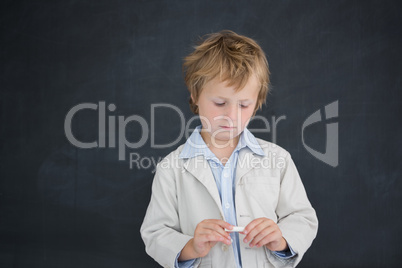 Boy as teacher in front of black board