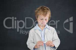 Boy as teacher in front of black board