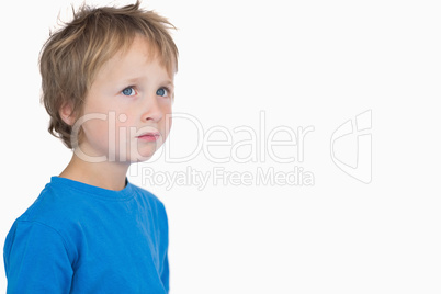 Cute young boy looking away