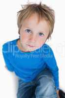 Portrait of cute young boy with blue eyes