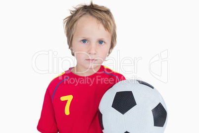 Portrait of young boy with football