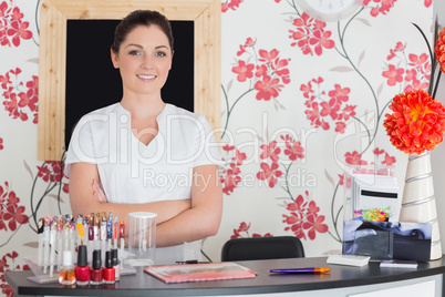 Confident woman at reception in nail salon