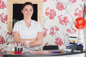 Confident woman at reception in nail salon