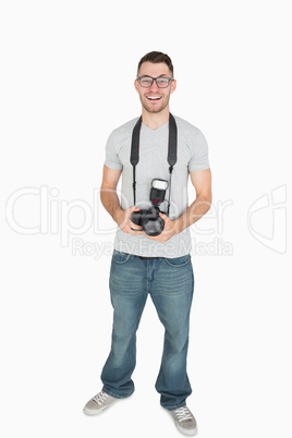 Portrait of male photographer with photographic camera