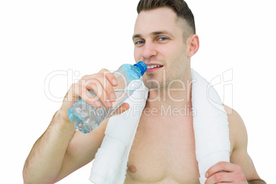 Portrait of man drinking water with towel around neck