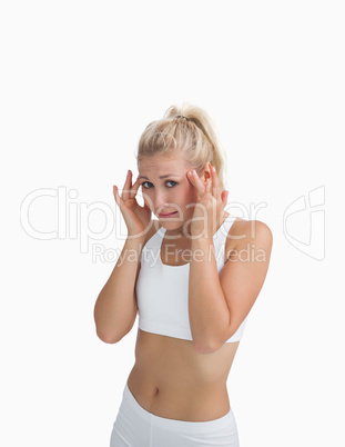 Young woman rubbing her temples