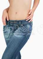 Midsection of slim woman in jeans