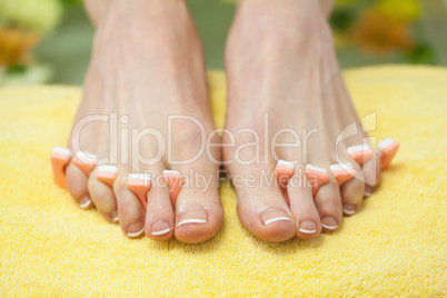 Close-up of french pedicured feet