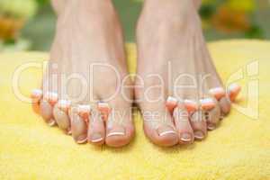 Close-up of french pedicured feet