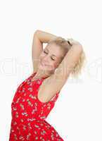 Young woman in red summer dress standing