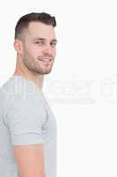 Side view portrait of smiling young man