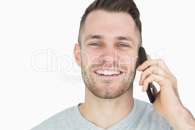 Close-up portrait of young man using mobile phone