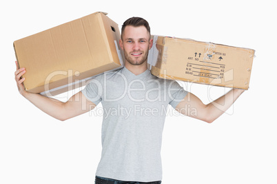 Portrait of young man carrying package boxes Portrait of young man carrying package boxes