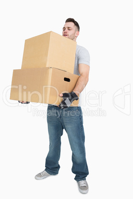 Young man carrying package boxes