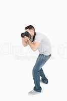 Young male photographer with photographic camera