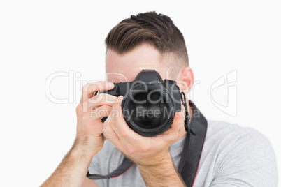 Close-up of photographer with photographic camera