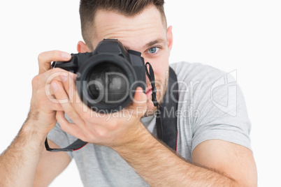 Close-up of male photographer with photographic camera