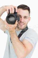 Portrait of male photographer with photographic camera