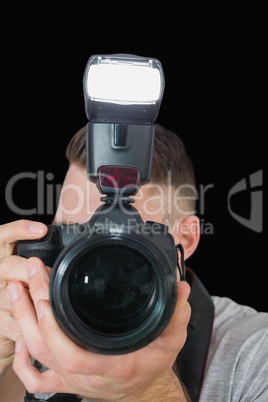 Close-up of photographer with photographic camera