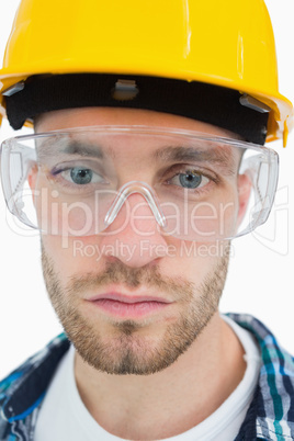 Close-up of architect wearing protective eyewear and hardhat