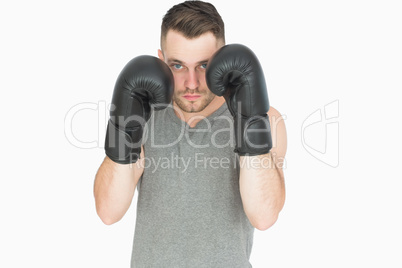 Portrait of young man in boxing stance