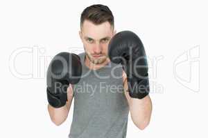 Portrait of young man in boxing stance