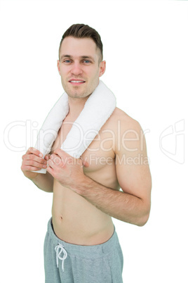 Portrait of happy man holding towel around neck