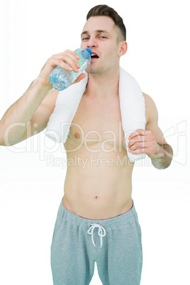 Portrait of man drinking water with towel around neck