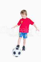 Little boy playing football