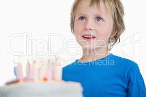 Cute little boy with birthday cake