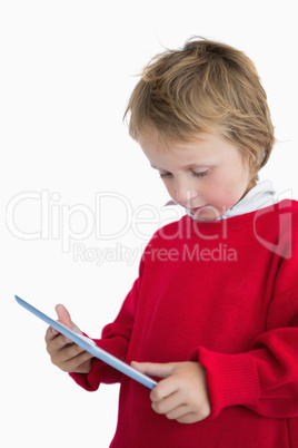 Little boy looking at digital tablet