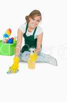 Portrait of young maid cleaning floor