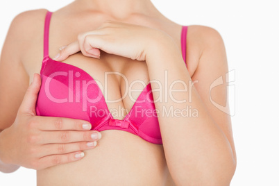 Close-up of woman performing self breast examination
