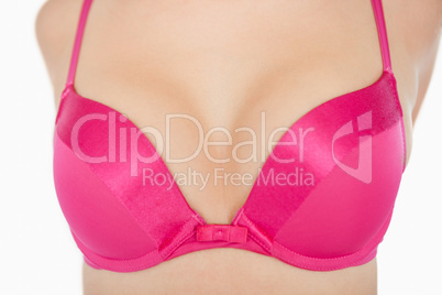 Extreme close-up of woman in pink bra