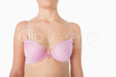 Midsection of woman in pink bra