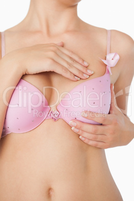 Close-up of woman performing self breast examination