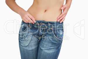 Midsection of slim woman in jeans